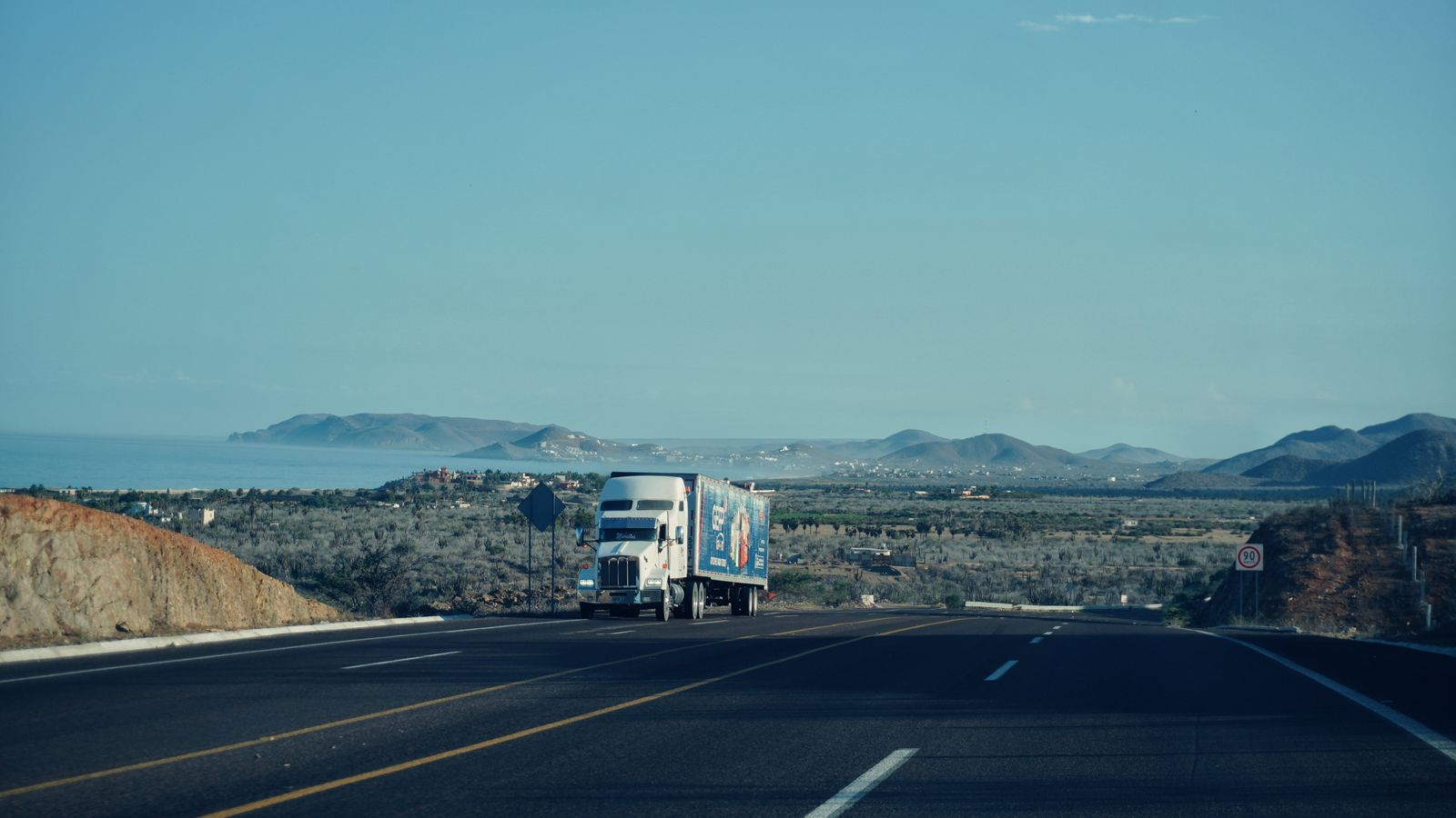 A tractor-trailer on the highway