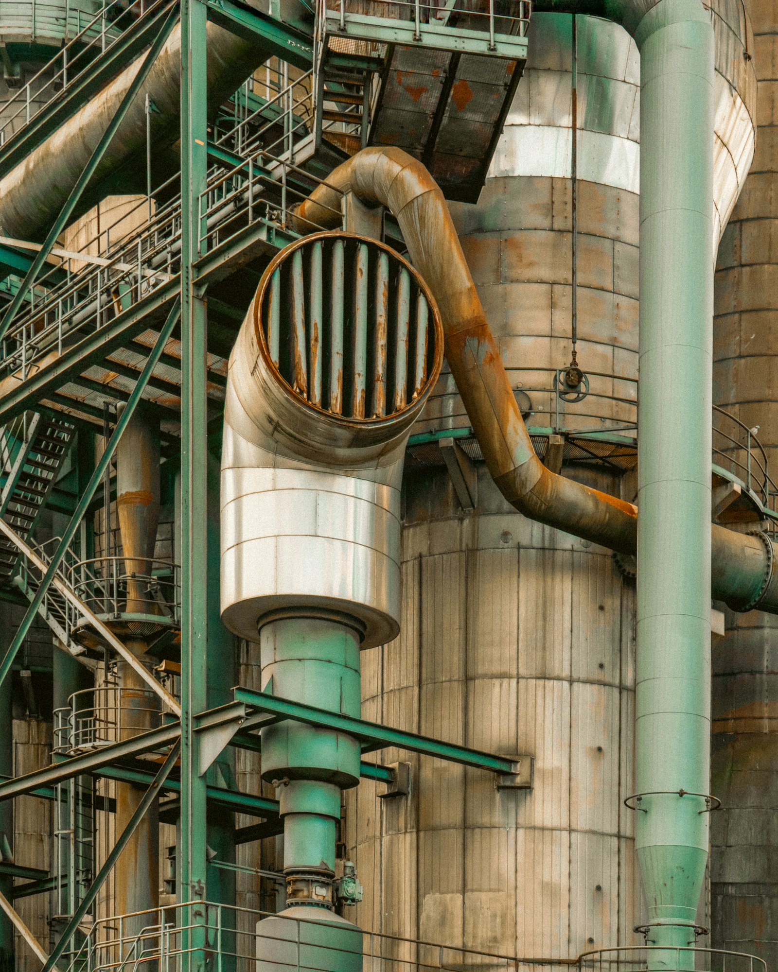 Industrial piping and machinery on a factory floor