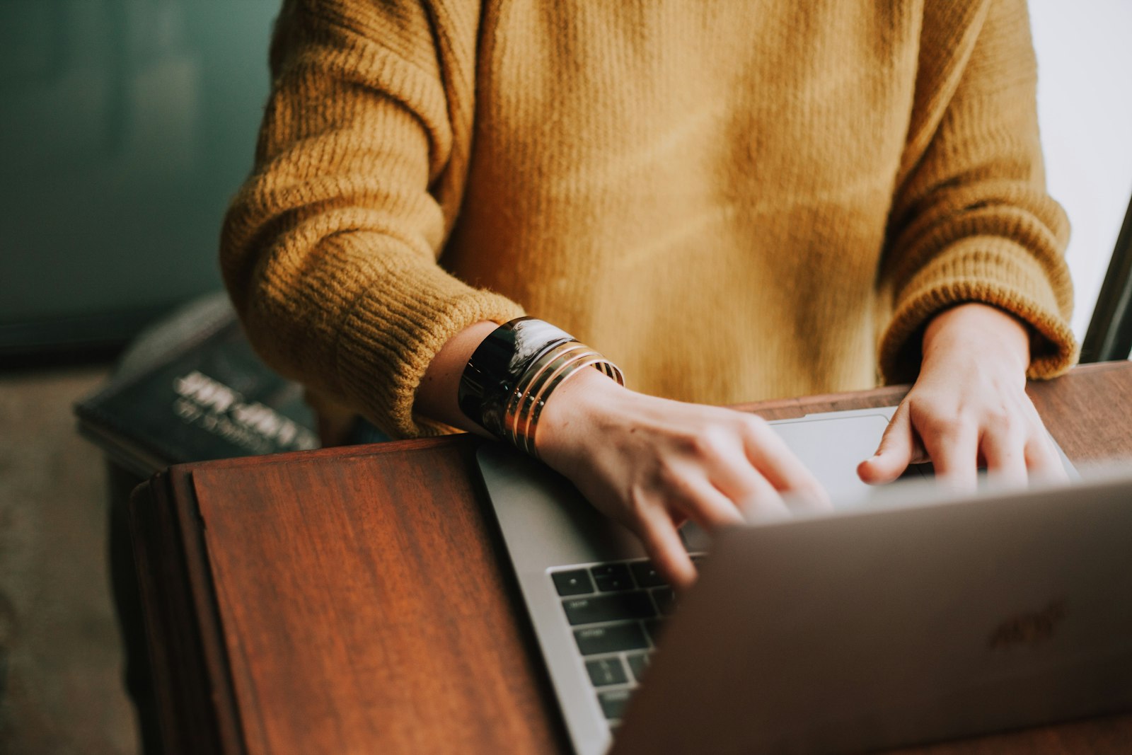 A small business owner working through the numbers on a laptop