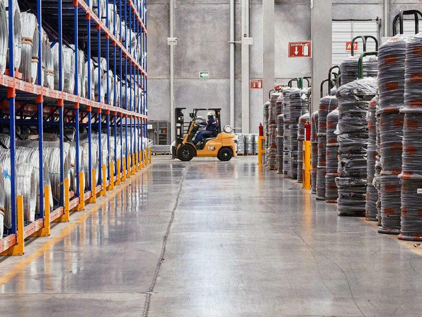 A warehouse aisle stacked with pallets
