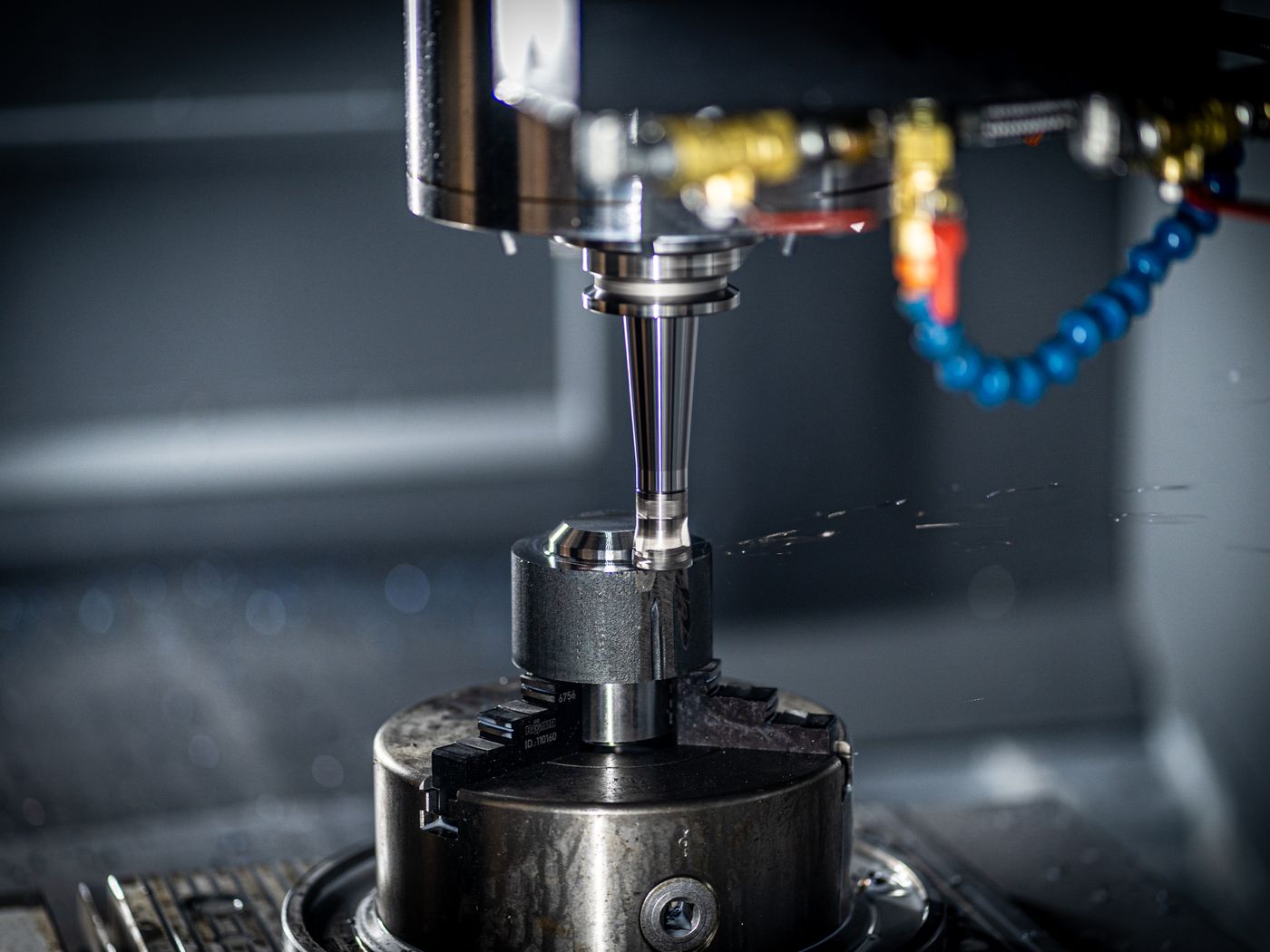 A CNC spindle and tooling cutting a part